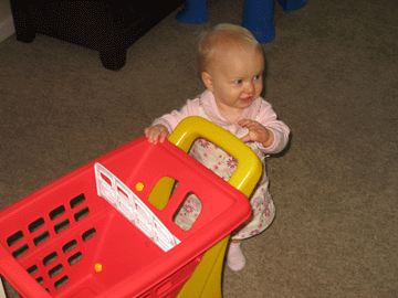 Pushing around her new shopping cart