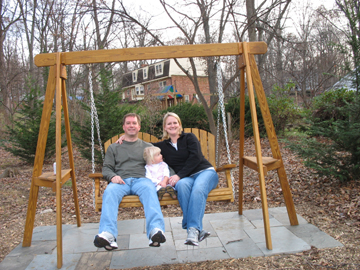 Daddy, Kaitlyn, and Mommy enjoying the swing