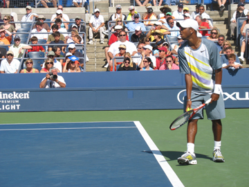 Donald Young serving