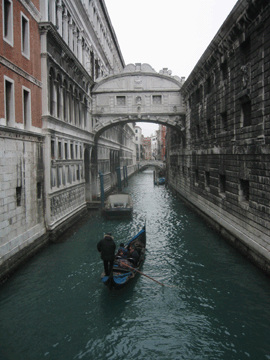 A gondola making its way down a canal