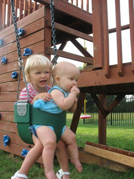 The girls swinging together