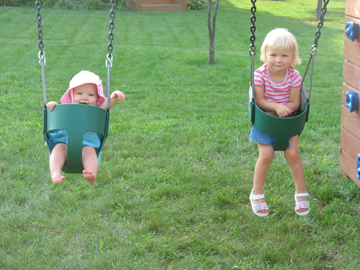 Swinging on their new swingset